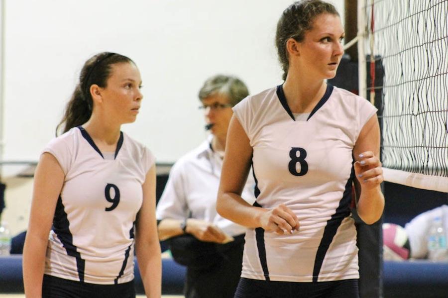 Sophomore Mary Grace Lally and freshman Luisa De La Hoz talk between points in a September match.