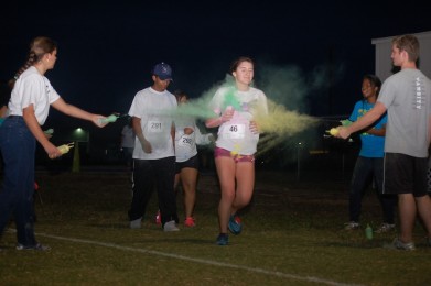 Sophomore Hannah Keats crosses the finish line in last Friday’s 5K color run.