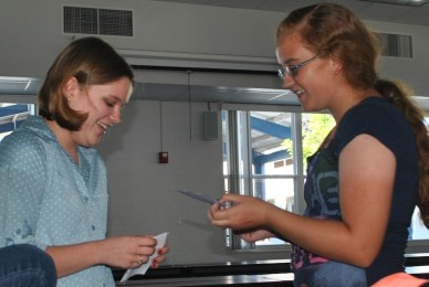 Juniors Bonnie Rice and Taylor Belinchak choose quotes start the Spook Improv Game.