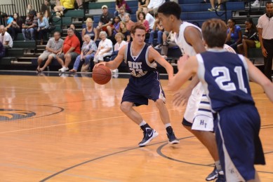 Junior Chris Mikulas takes a retreat dribble in a game against Holy Trinity