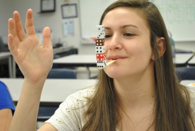 Preparing to film a WCTZ commercial for Minute to Win It, junior Alyssa Gorewitz practices Minute to Win It games.