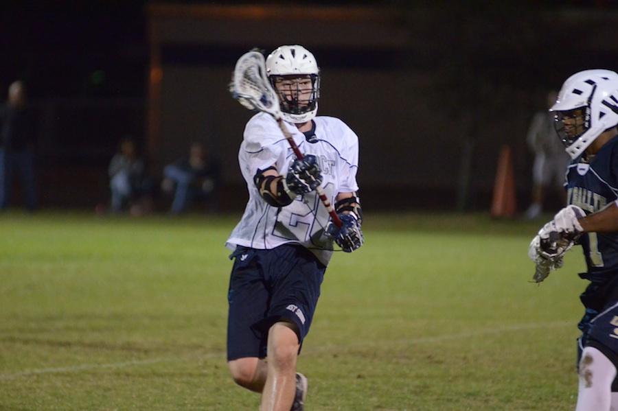 Senior Ryan Bellone whips a shot towards the goal in a 2013 game