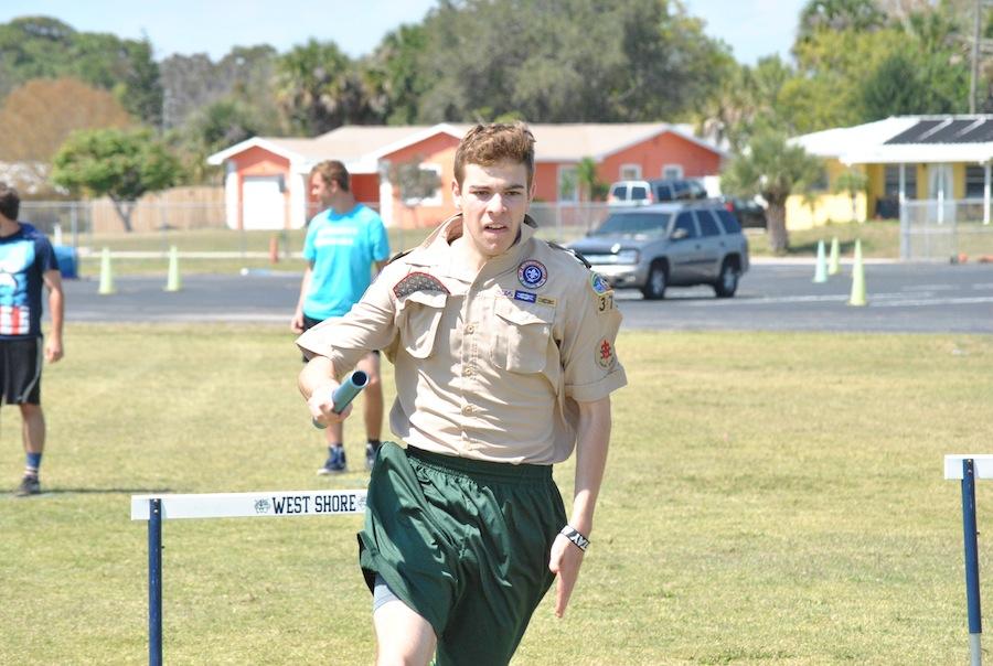 An emotional senior Patrick Furino dashes to the finish in the relay race.