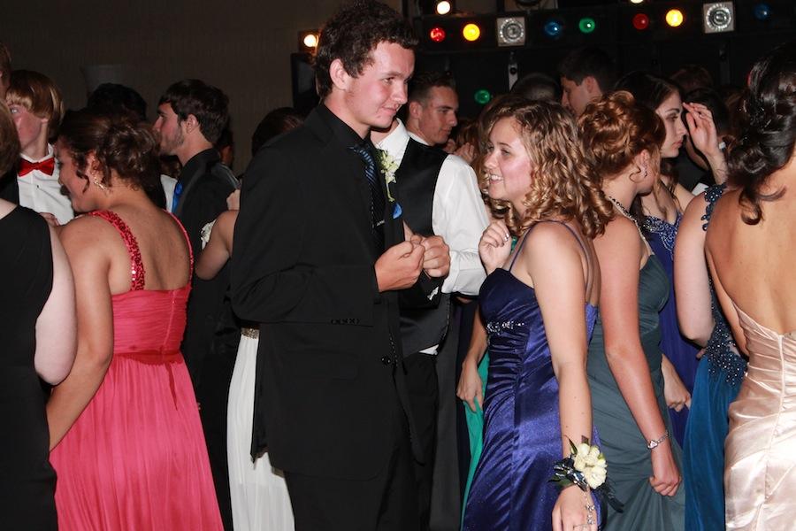 All dressed up, juniors Gabrielle Jefferson and Robert Breninger dance together.