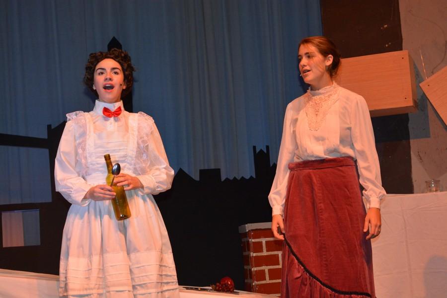 Senior Kaylee Willner (Mary Poppins) and junior Emily Browne (Winifred Banks) perform “A Spoonful of Sugar.”