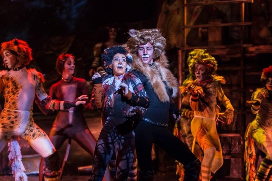 On stage, junior Ian Kennedy performs in “Cats.”