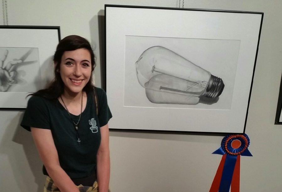 Senior Liliana LeBeau shows her winning entry at Eastern Florida State College.