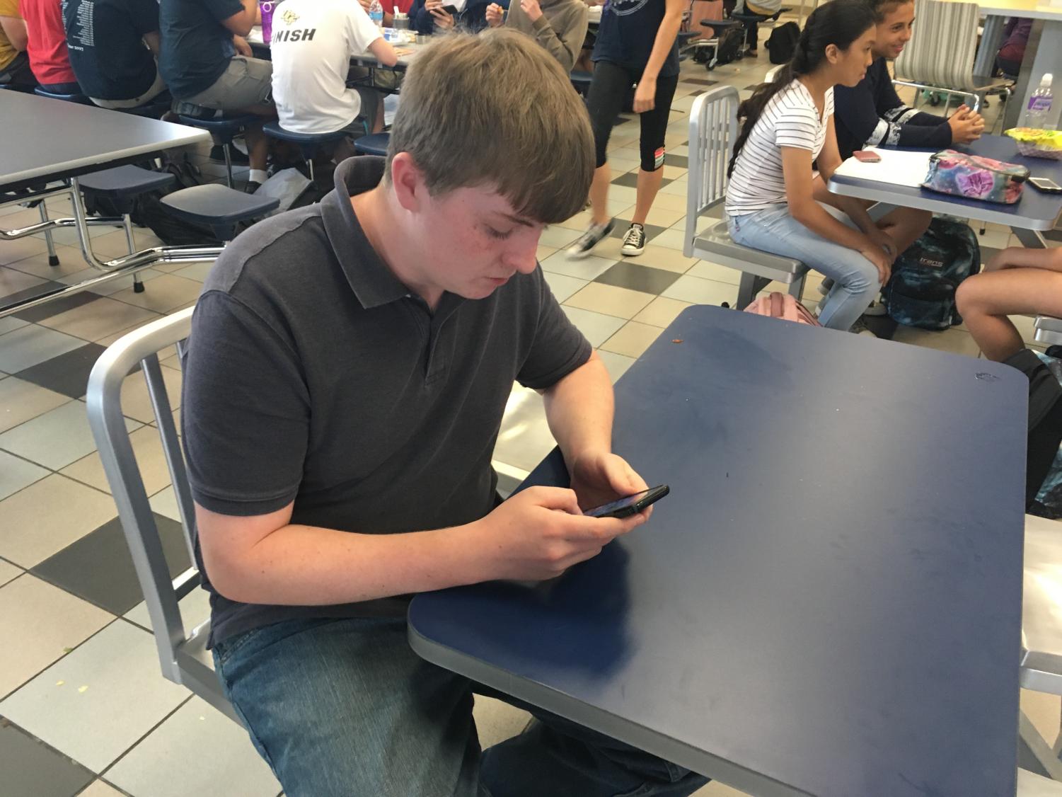 Freshman Reilly Afflerback takes advantage of newly relaxed cell phone policy during a recent Power Hour.
