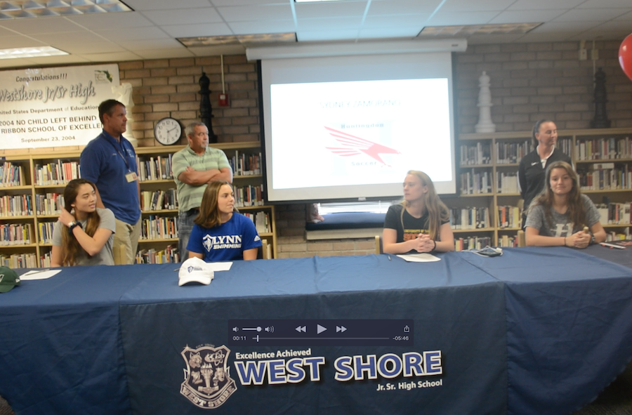 Seniors Giao Huynh, Shelby McKeever , Elena Barr and Sydney Zamorano signed in the media center Wednesday.