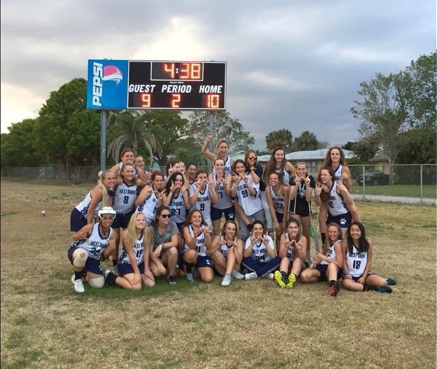 The+girls%E2%80%99+lacrosse+team+celebrates+its+victory+over+MCC+on+Monday.