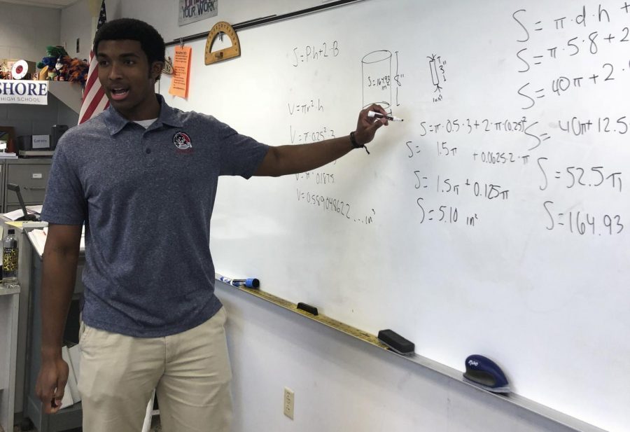 Florida Tech student Trevor Smith teaches a concept in Don Gornto’s geometry class.