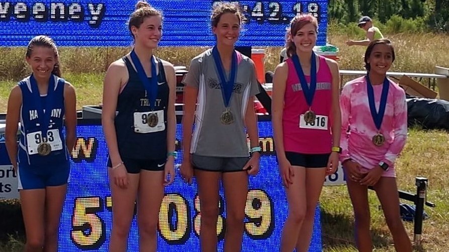 Sophia Bailly (second from right) poses with her second-place medal.