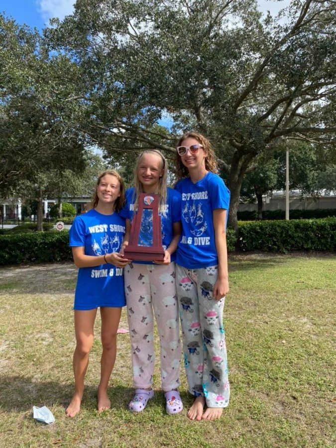 Kalia Clary (11), Layla Auter (12), and Allison Clark (11) with regional trophy.