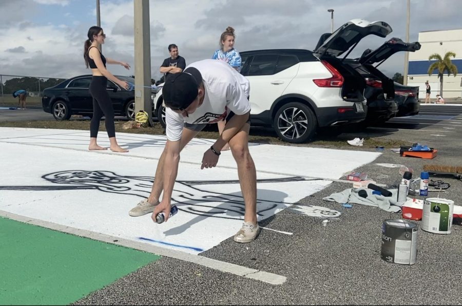 Seniors begin to paint their parking spaces on Jan. 23. For some, the process took four hours.