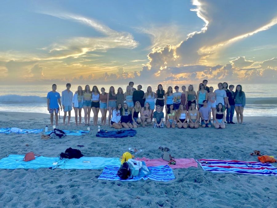 The senior class enjoying the sunrise at 5th Avenue Beach to celebrate the start of the school year. 