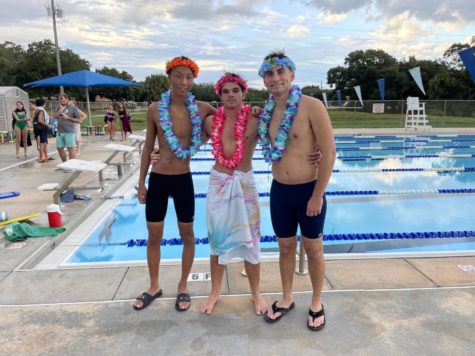 Seniors Victor Liu, Jackson Ehlers and Lance Stern celebrate Senior Night on Sept. 19 at the Fee Avenue pool.