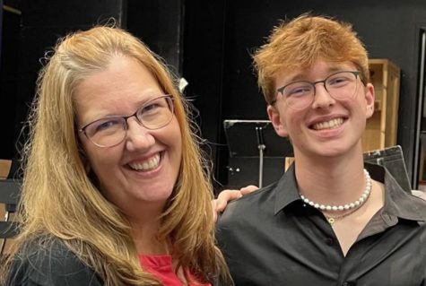 Happy about the concert success, Grant Newcombe poses for a photo with his mom.
