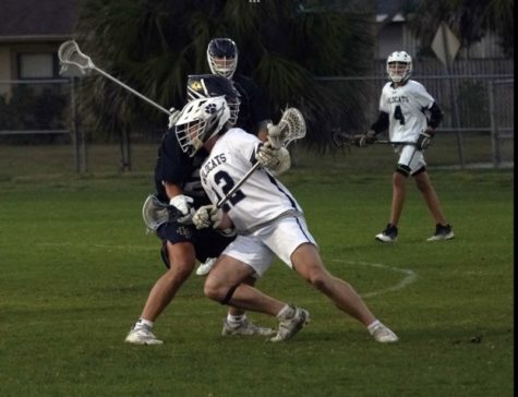 Zach Johnson and Kody Wessel playing a game against Holy Trinity Episcopal Academy on Feb. 23. 