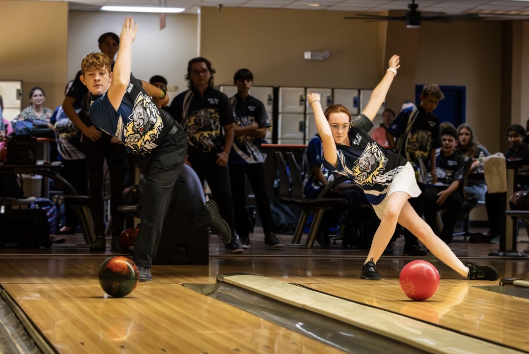 Ian (12) and Genevieve Giguere (10) bowl at Shore Lanes in Palm Bay on Oct. 15. “[Playing together] makes for a high amount of competition, Genevieve said. With this I believe that we both definitely gain in performance, as we push each other to the top of our game.”