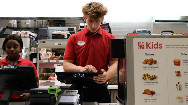 College student Kadriana Wedderburn and senior Ethan Bergman work the closing shift at the Melbourne Square Mall Chick-Fil-A