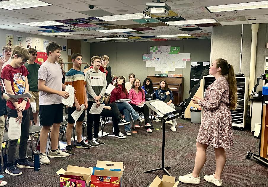 Music teacher Kristen Ross instructs students at an afterschool chorus rehearsal on Feb.22.