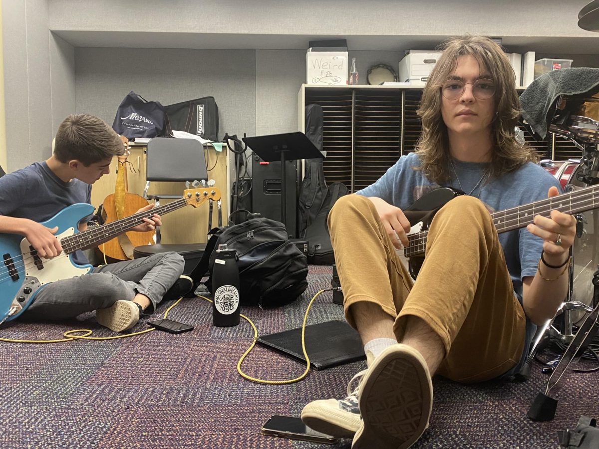Junior June Griffith began playing the guitar just over a year ago and often practices in the school’s band room. “Our bodies are below, but it’s as if we’re the music and the music is us, and for a moment, we’re one,