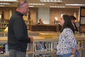 Burt Clark, future West Shore principal, talks to Spanish teacher Mrs. Stewart after announcing he will take over the position of principal following current principal Rick Fleming's retirement. "I think it's really nice that we are going to have someone who is committed to being a Wildcat", Stewart said.