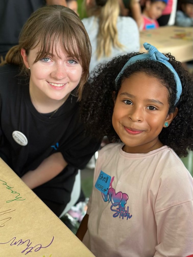 Drawing together, senior Addyson Leathers spends quality time with a young Costa Rican girl. "I just think it's such a good opportunity to voluntarily take time out of your summer to go help these kids," Leathers said.