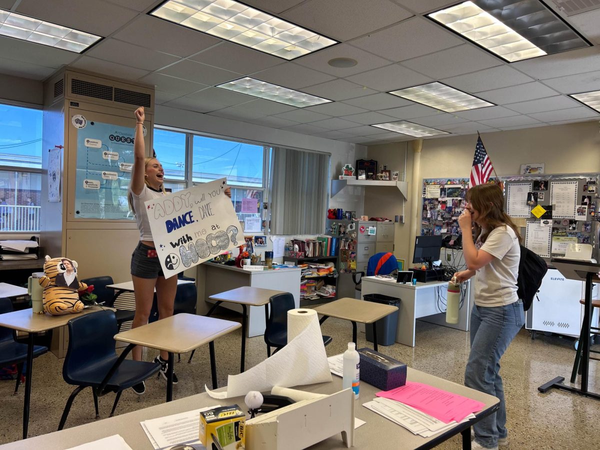 Senior Evy Nigh pops the question asking senior Addyson Leathers to be her homecoming date on Sept. 20. "I was so excited that it was about Fall Out Boy, something that is so personal for me," Addyson said. "Obviously I said yes!"