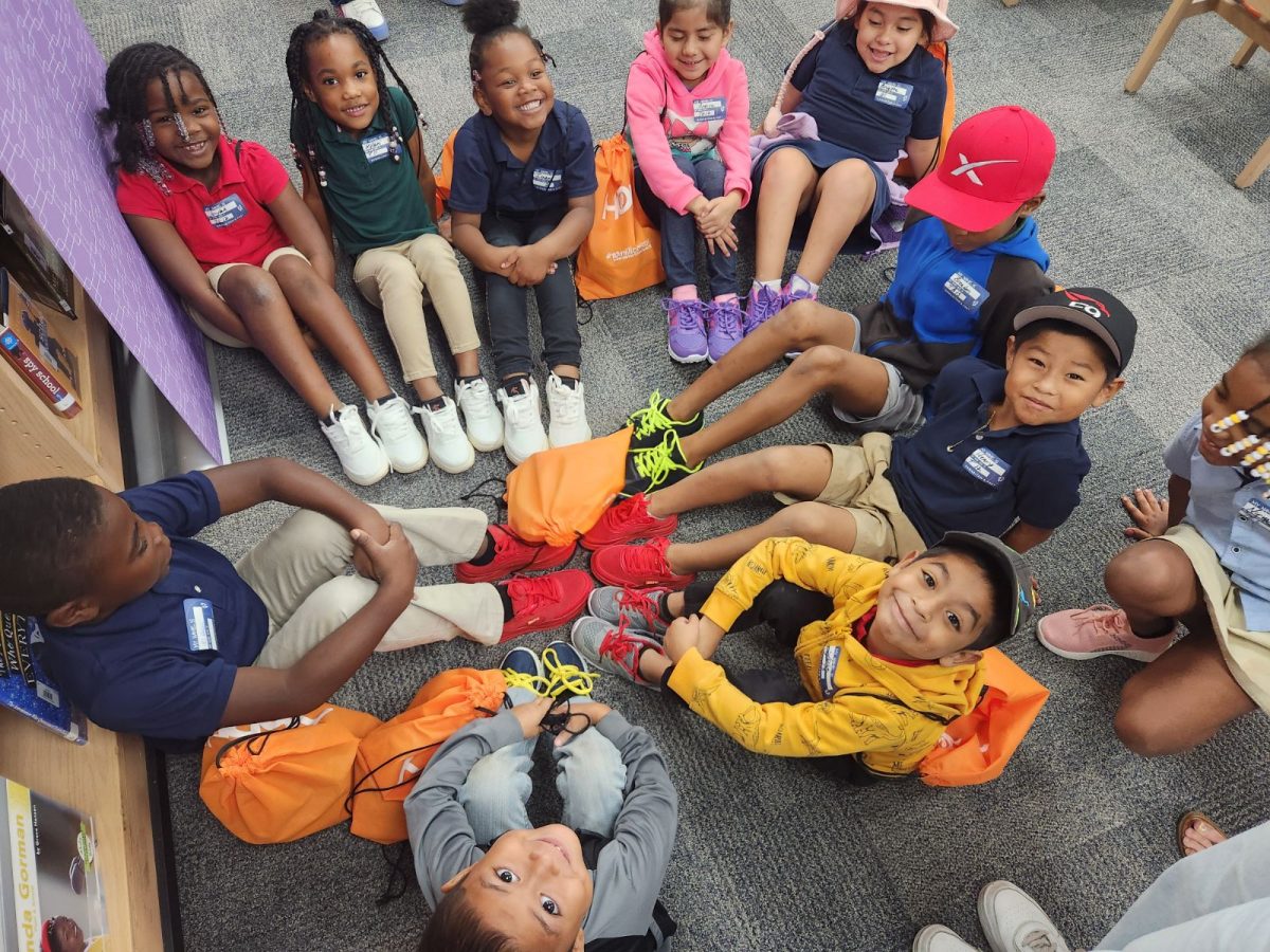 On Oct. 29, first grade students at Endeavour Elementary display their new shoes during the Samaritan's Feet shoe giveaway. The organization partnered with Truist Financial to provide every student on campus with new shoes, socks and a tote bag. 