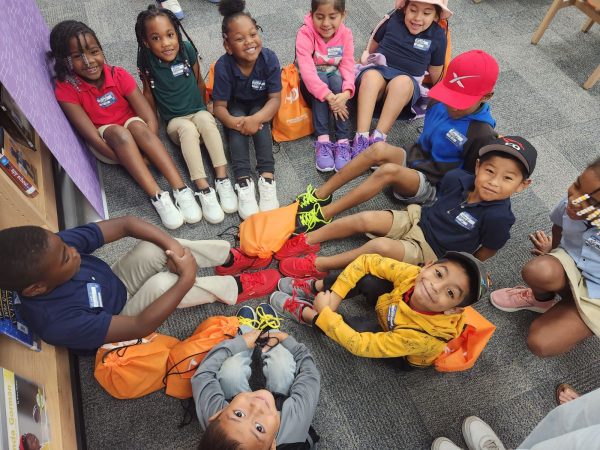 On Oct. 29, first grade students at Endeavour Elementary display their new shoes during the Samaritan's Feet shoe giveaway. The organization partnered with Truist Financial to provide every student on campus with new shoes, socks and a tote bag. "They are so excited," Christina McPherson said. "Several had holes in their shoes and hardly any had socks on."