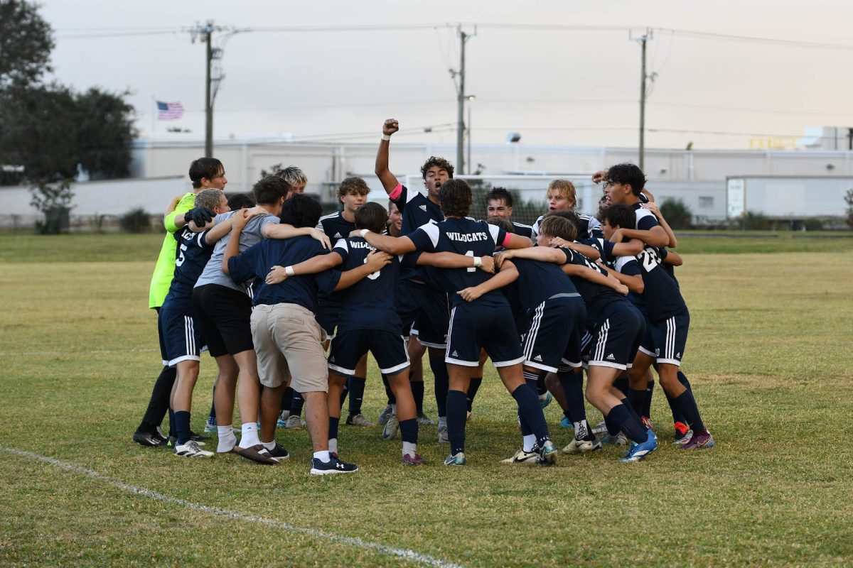 Senior Athan Zaiden leads the boys' varsity soccer team in a pregame chant before taking on Viera High School at home. 