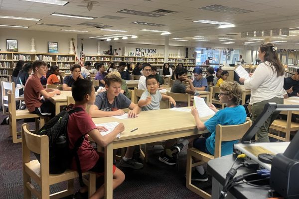 FPS members gather in the media center as sponsor Chloe Radd (right) teaches the six-step problem-solving method on Sept. 4.