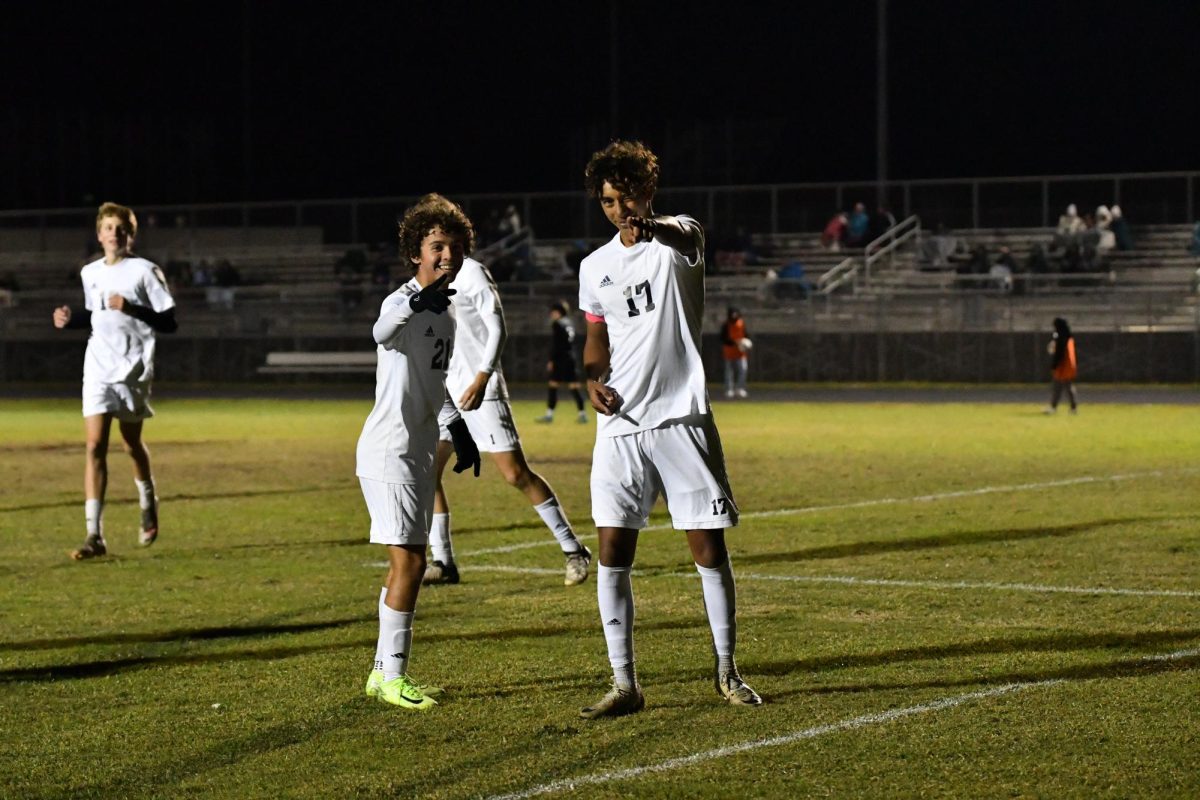 Senior Athan Zaiden (right) and junior Diego Prieto celebrate a goal scored against Heritage High School leading to a 2-0 victory on Jan. 7. "It was an important win for the team," Zaiden said. "It was freezing, but I'm colder."