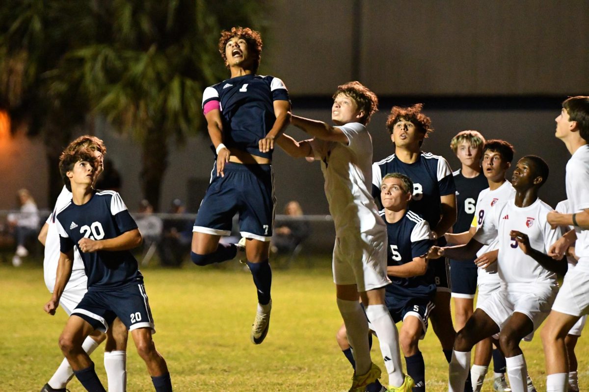 Senior Athan Zaiden jumps for a header during a 3-1 win against Centennial on Nov. 19.