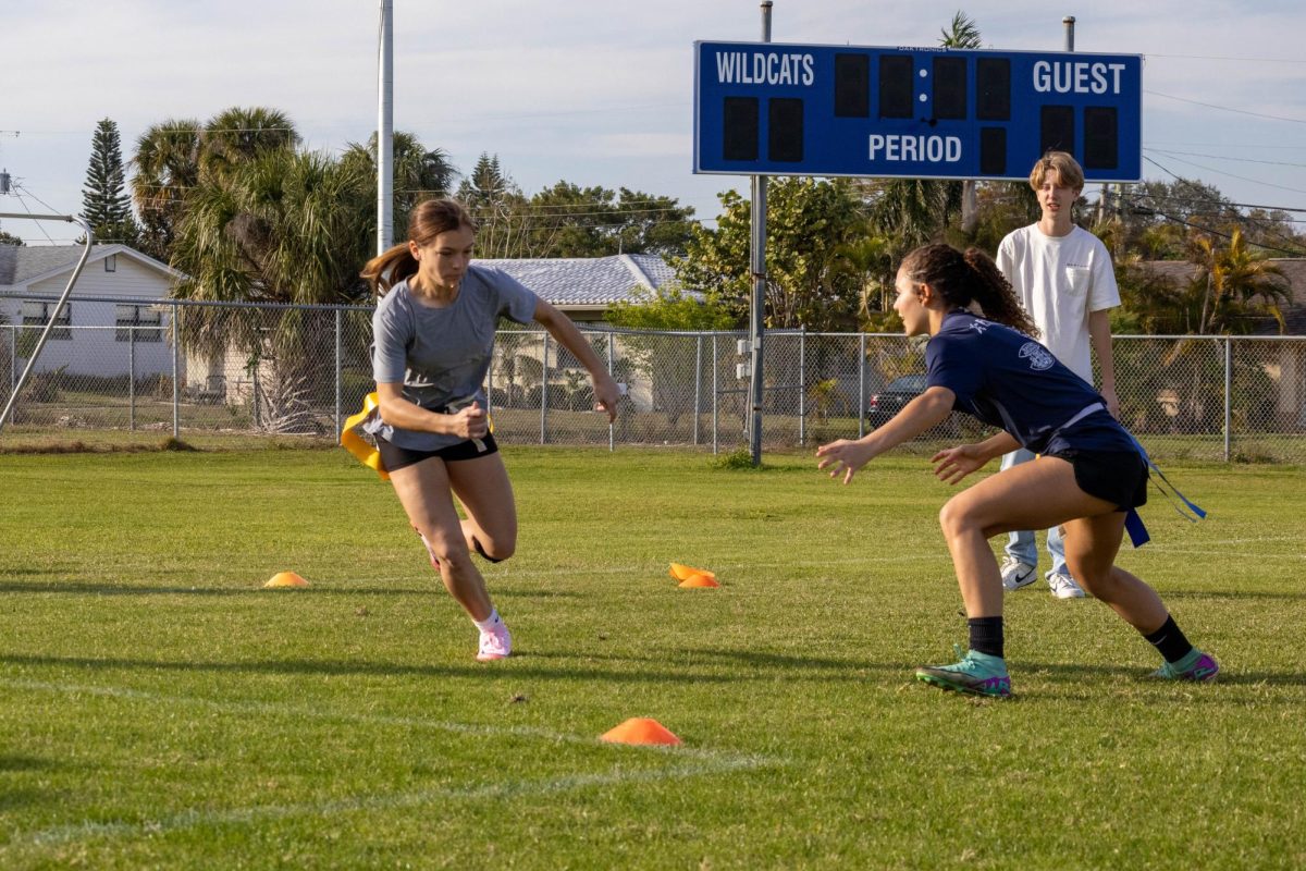 The girls flag football team runs drills at the first practice of the season. “We are going up against a lot of teams that have been playing this for multiple years,” Coach Austin Glezen said, “But I think that the talent we have will surpass some of that learning curve.”