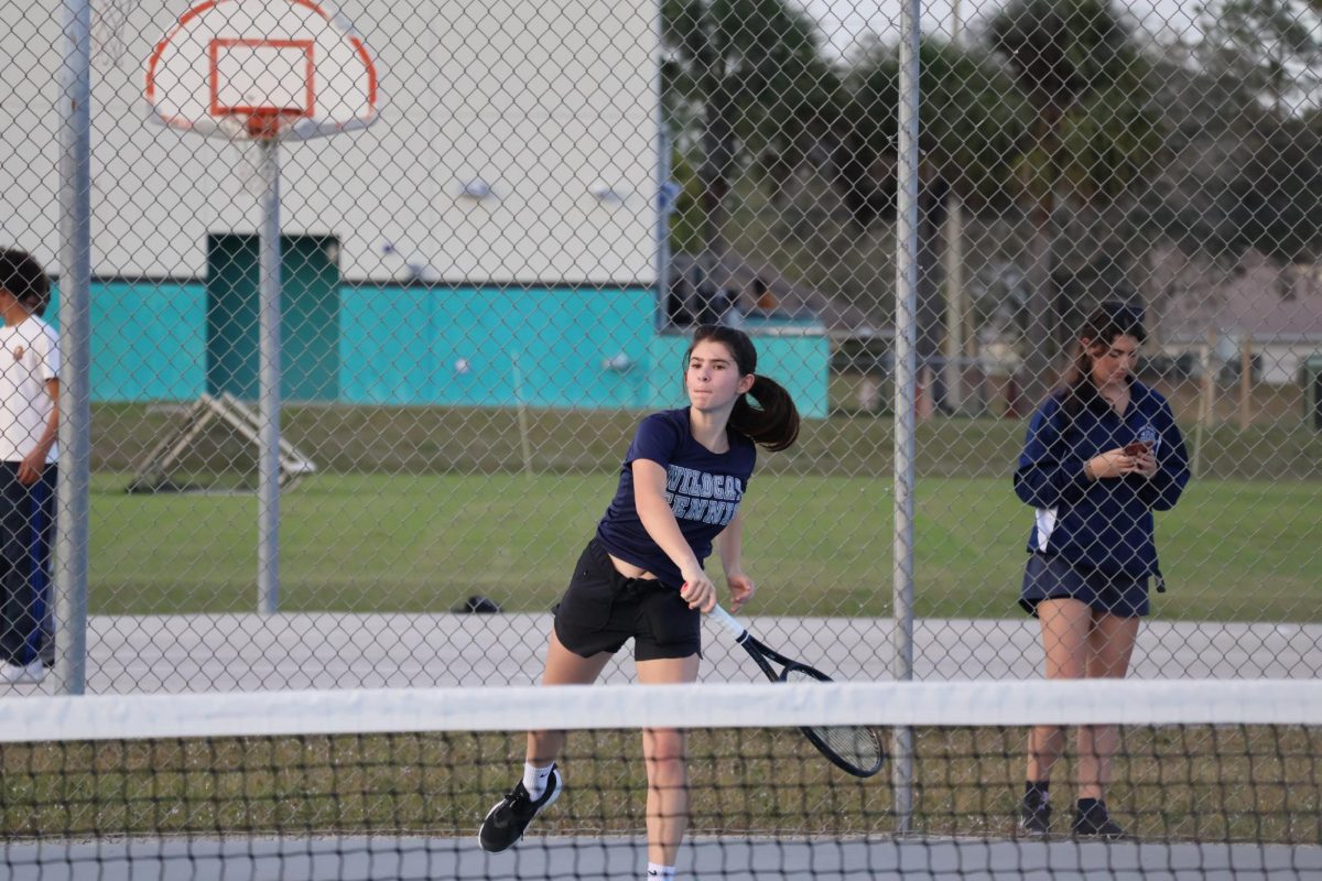 Senior Aubrey Reiter serves the ball during her match against Bayside on Feb. 4.