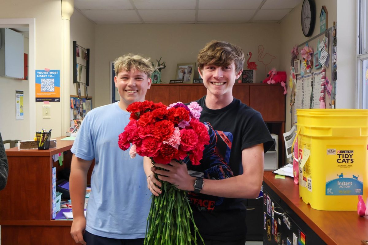 Freshman Max Wahl (left) and his friends sent freshman John Murphy 102 Valentine's carnations on Feb. 14. "I didn't know what to do at first," Murphy said. "[My friends] did this last year, but it was only 17 flowers. This year it was 102."