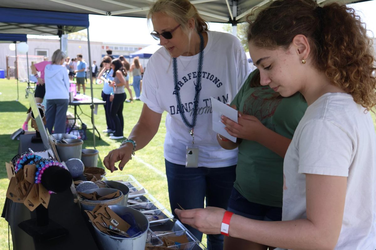 People browse handmade jewelry created by sophomore Emily Moseley.