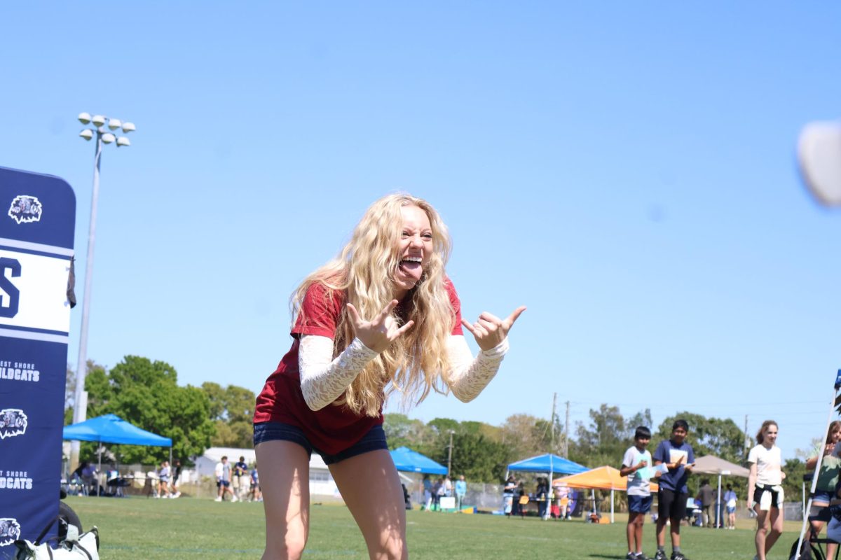 Senior Nicole Riopelle strikes a pose after her air guitar performance.