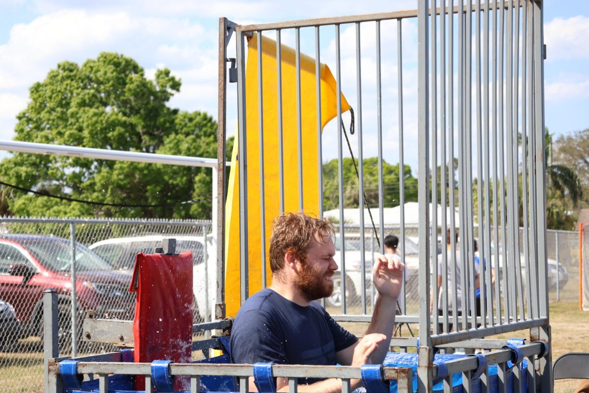 Government and economics teacher Austin Glezen gets dunked during his 3:30 dunking shift.