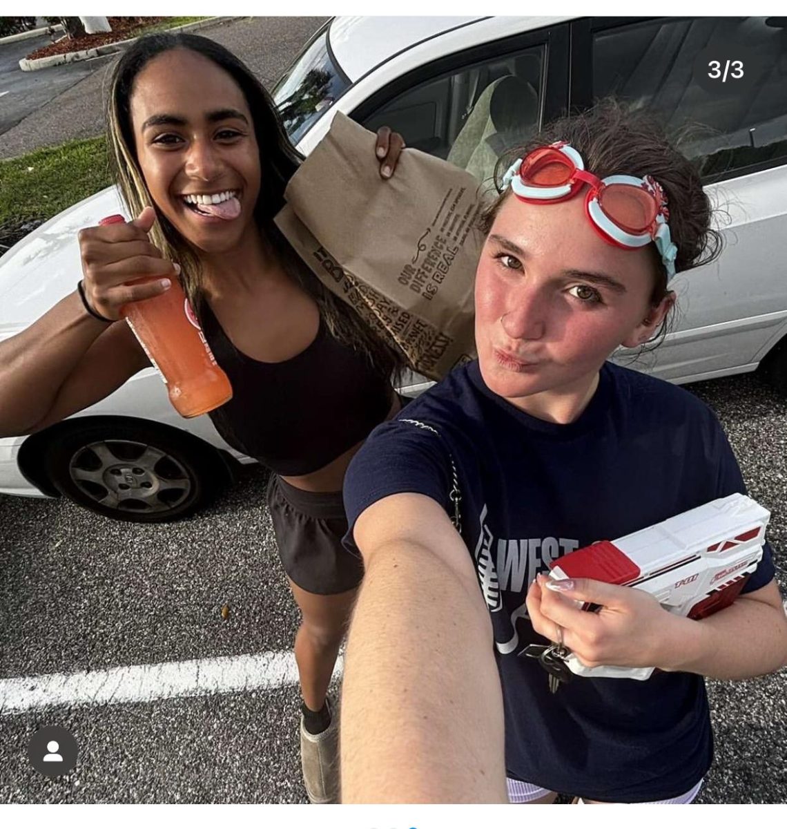 Senior Reese Armstrong (right) eliminates senior Lea Bygrave from the Senior Assassin competition on April 7.