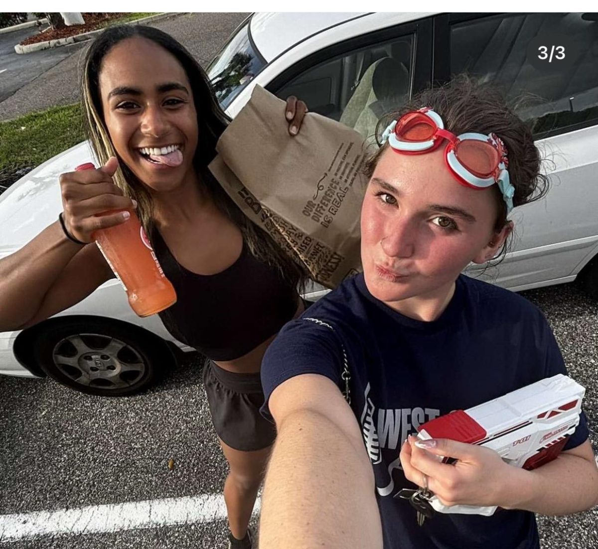 Senior Reese Armstrong (right) eliminates senior Lea Bygrave from the Senior Assassin competition on April 7.