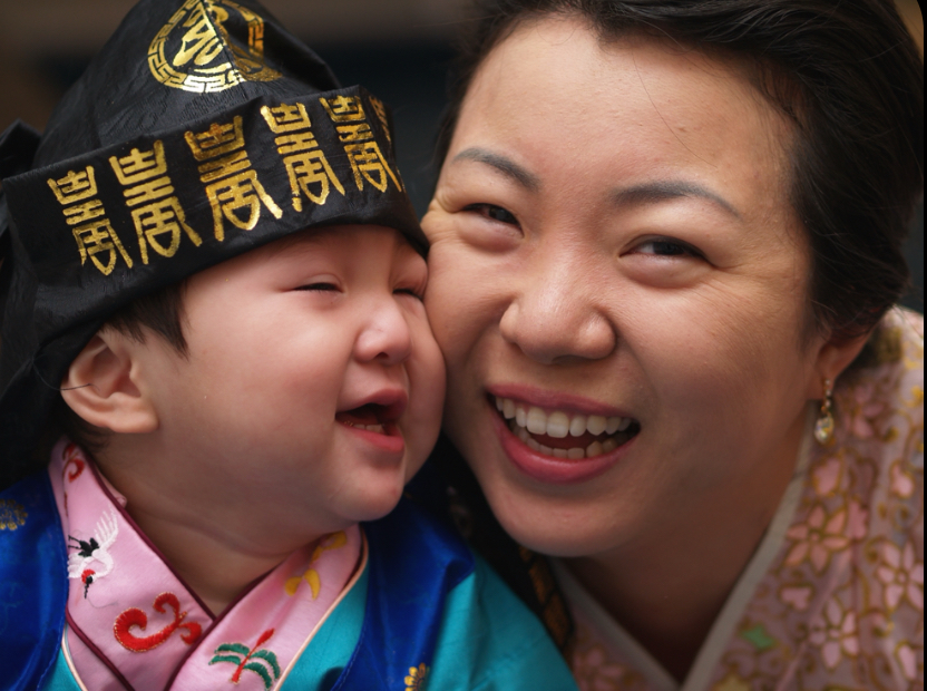 After the death of his father called Bokman Han and his wife, Dong Eun Kim, to return to Seoul, junior Solomon Han (left), dressed in a traditional hanbok, celebrated his first birthday in South Korea.