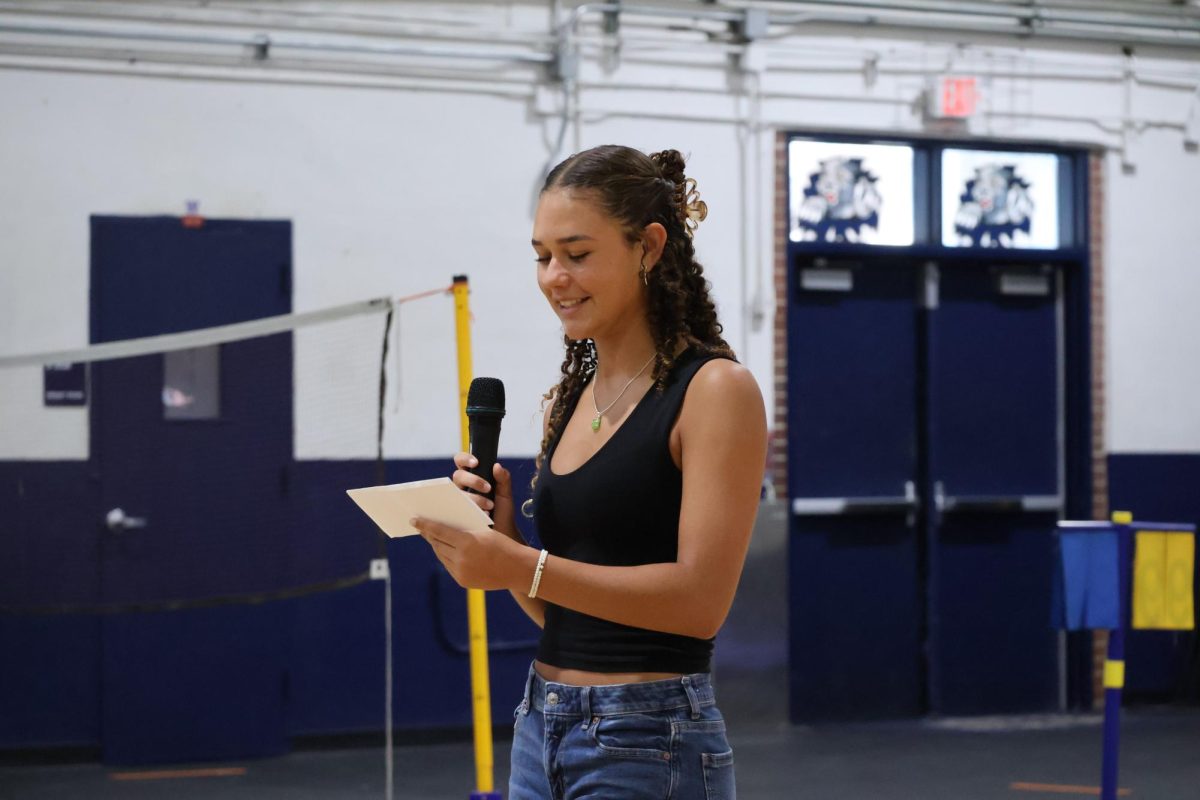Junior Violet Castillo, who is running for senior class treasurer, gives her campaign speech on April 23.