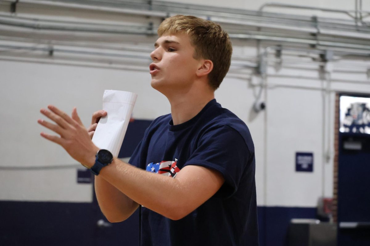 Junior Jack Grimison, who is running for senior class secretary, gives his campaign speech on April 23.
