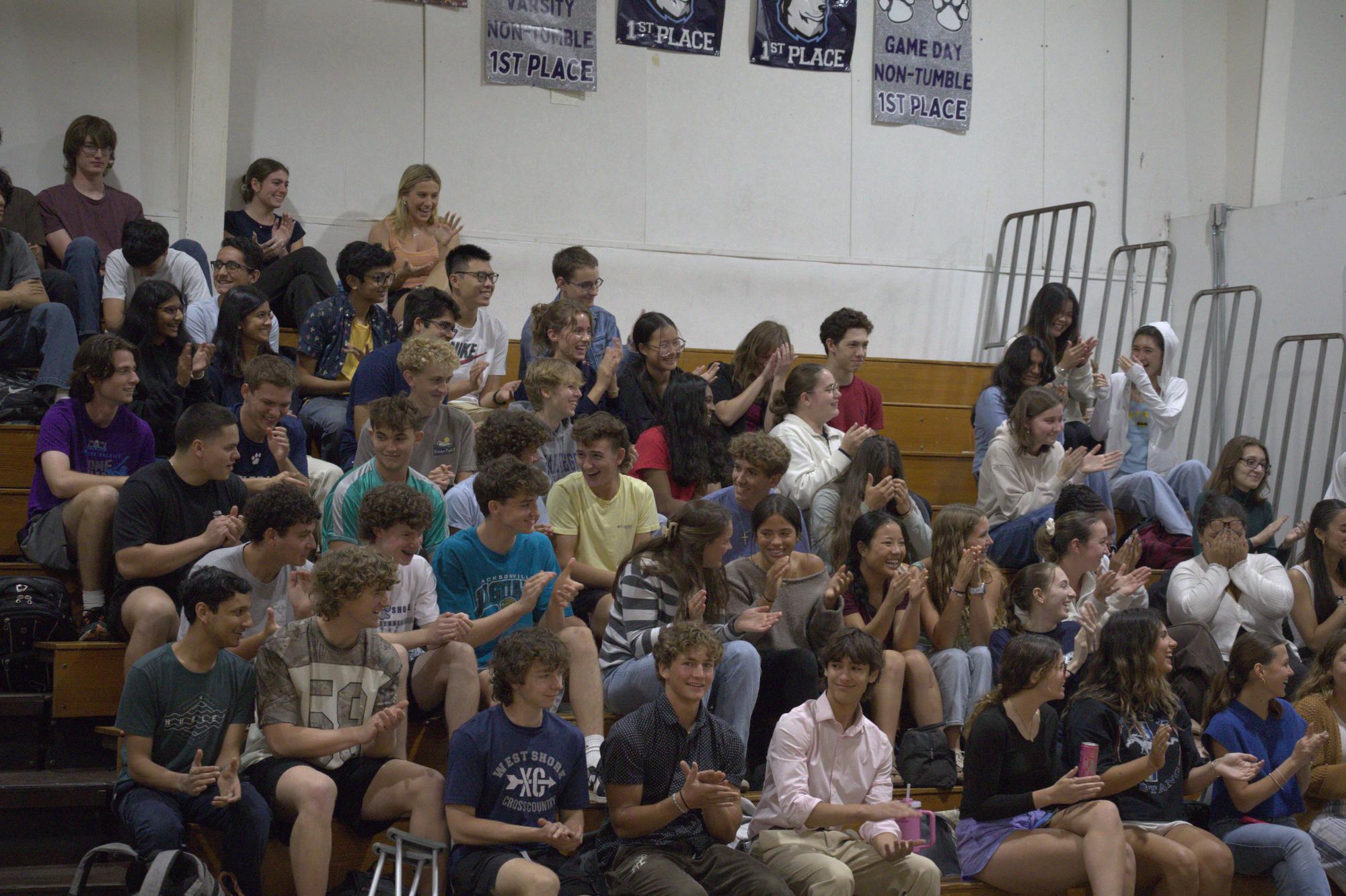 Juniors listen to senior class officer candidates' speeches in the gym on April 23.