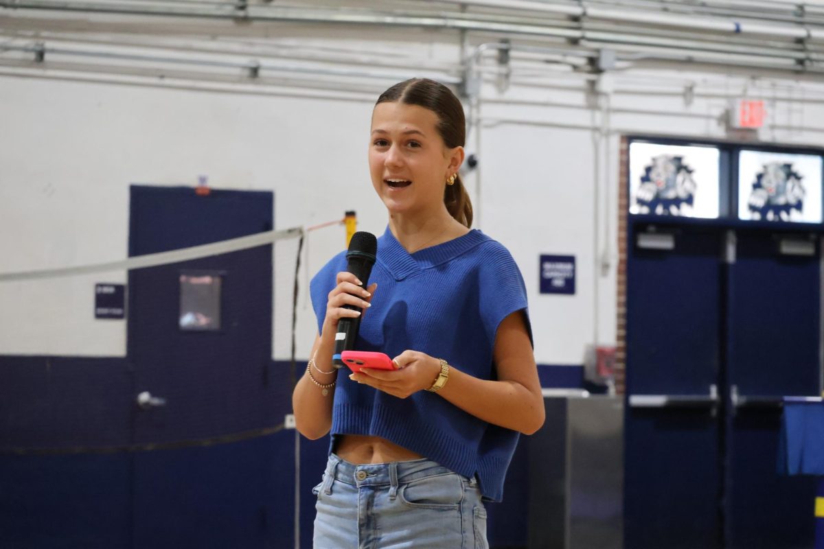 Junior Bailey Kidd, who is running for senior class president, gives her campaign speech on April 23.