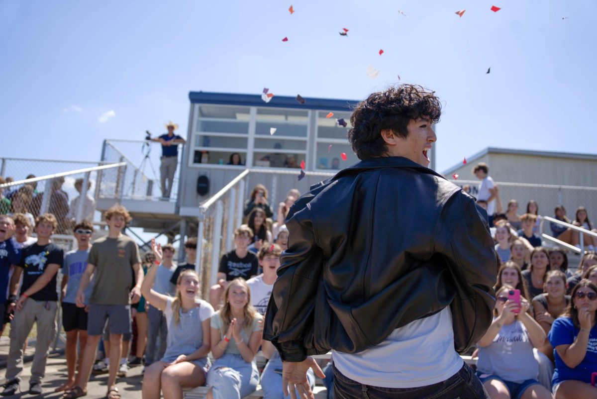 Senior Laith Zavala gives an air-guitar performance during the Spring Fling on March 13. Senior Laith Zavala strums an imaginary guitar during a competition. “Me, the lads, the gentlemen and the gentlewomen had amazing performances,” Zavala said. “For the first time, I like an event here and I hope they make it a tradition to inspire young cats to get wild and rock’n’roll.”