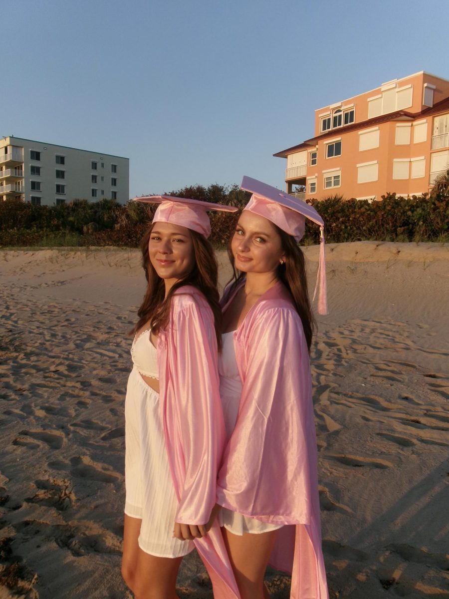 Seniors Emily Eason (left) and Chloe Marrs pose on the beach as their graduation date approaches.
